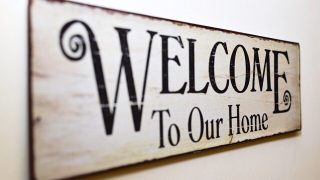 Welcome To Our Home sign.