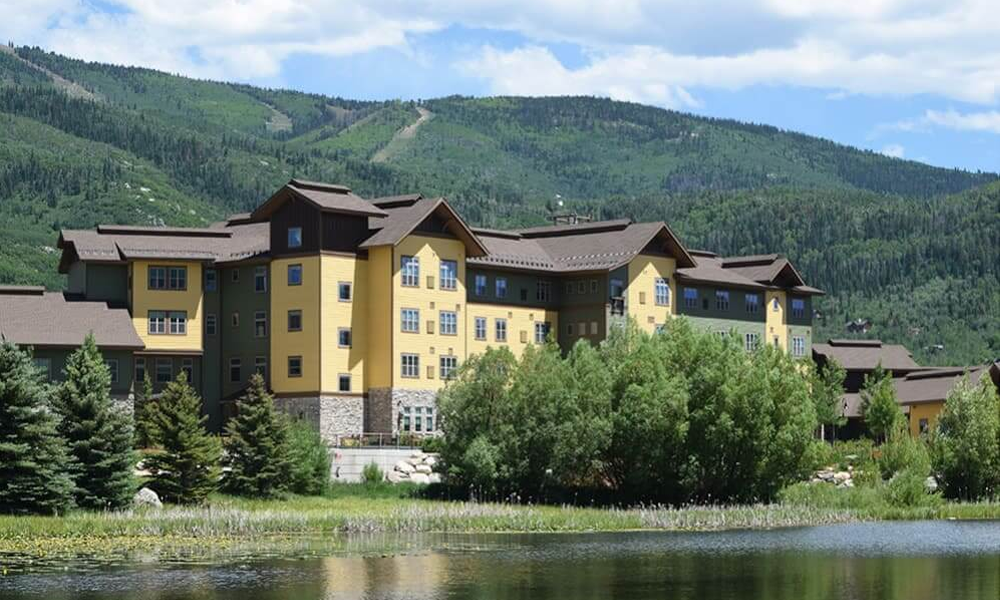 Exterior of Casey's Pond with Steamboat Springs ski resort in the background