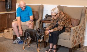 Couple enjoys spending time with their dog
